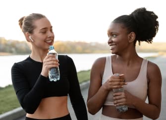 girls drinking water during workout